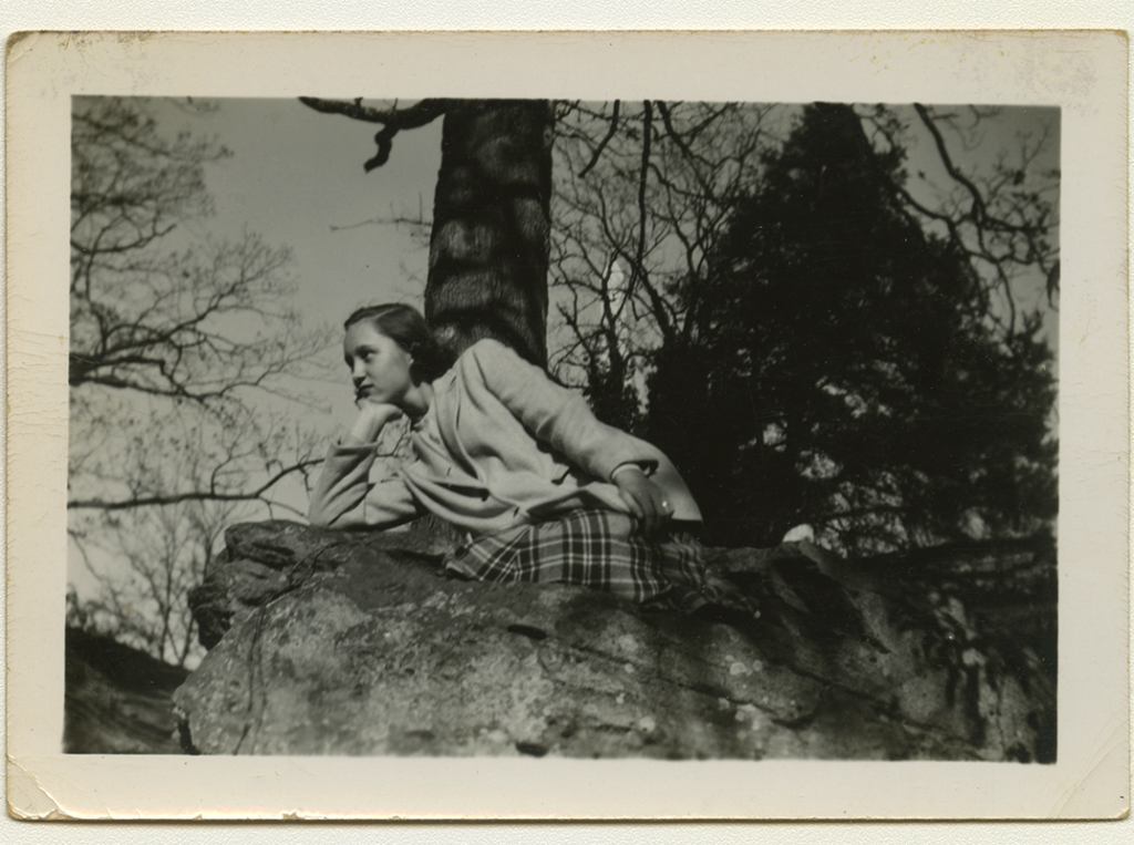 Sandra Maynard on a rock at the Mary Washington Monument