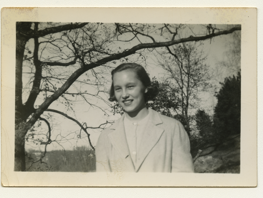 Black and white polaroid of family friend Sandra Maynard outside