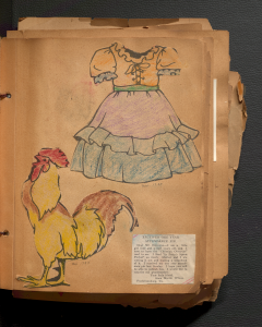 This page of Anne Martin Wilson's childhood scrapbook features a newspaper clipping and two childhood coloring pages.